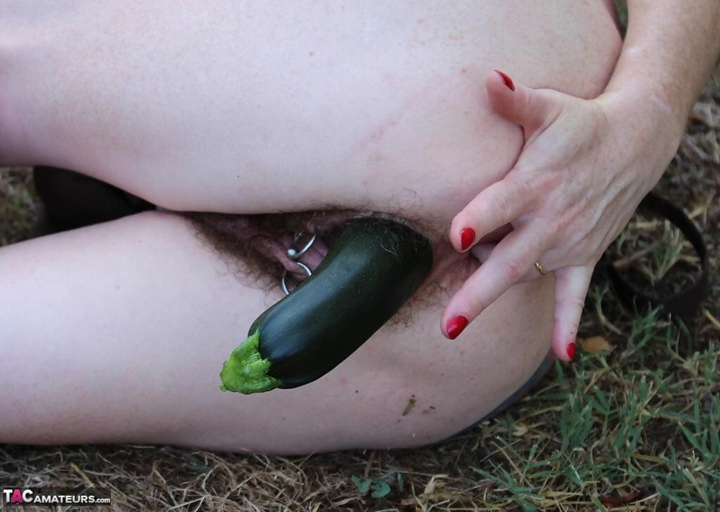 Mature woman Mary Bitch shoves seasonal veggies up her snatch in garden page 1
