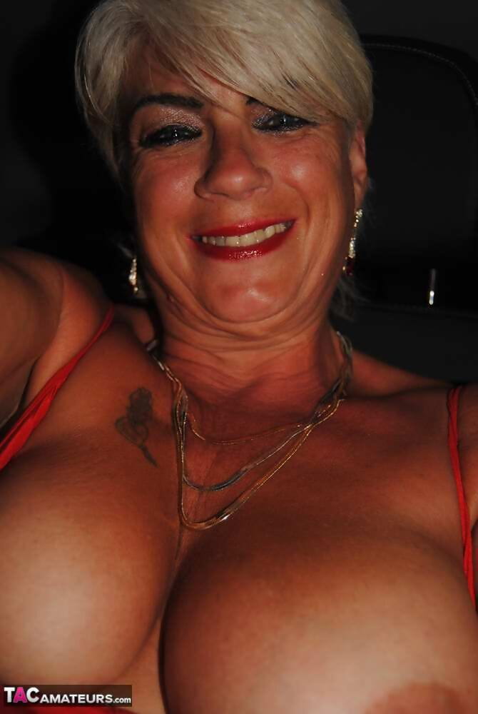 Busty hot mature Dimonty shows off her great legs & big tits in public page 1