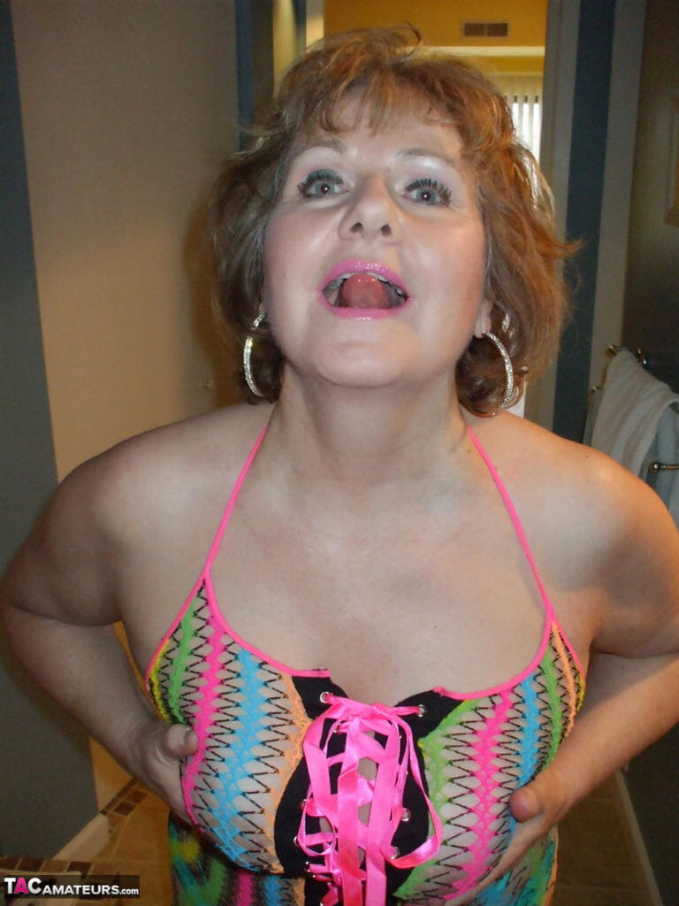Mature wifey Busty Bliss posing in her exotic see through mesh top page 1