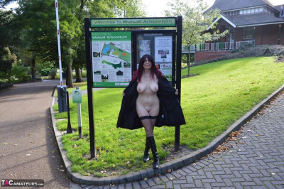 Chubby mature Barby Slut in coat flashes her big saggy boobs on the street