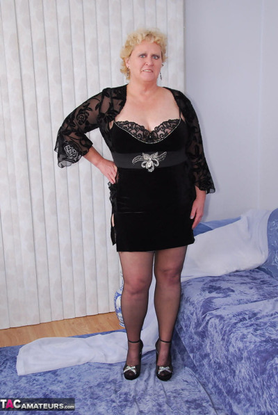 Mature fatty Fanny removes cotton underwear in stockings and heels