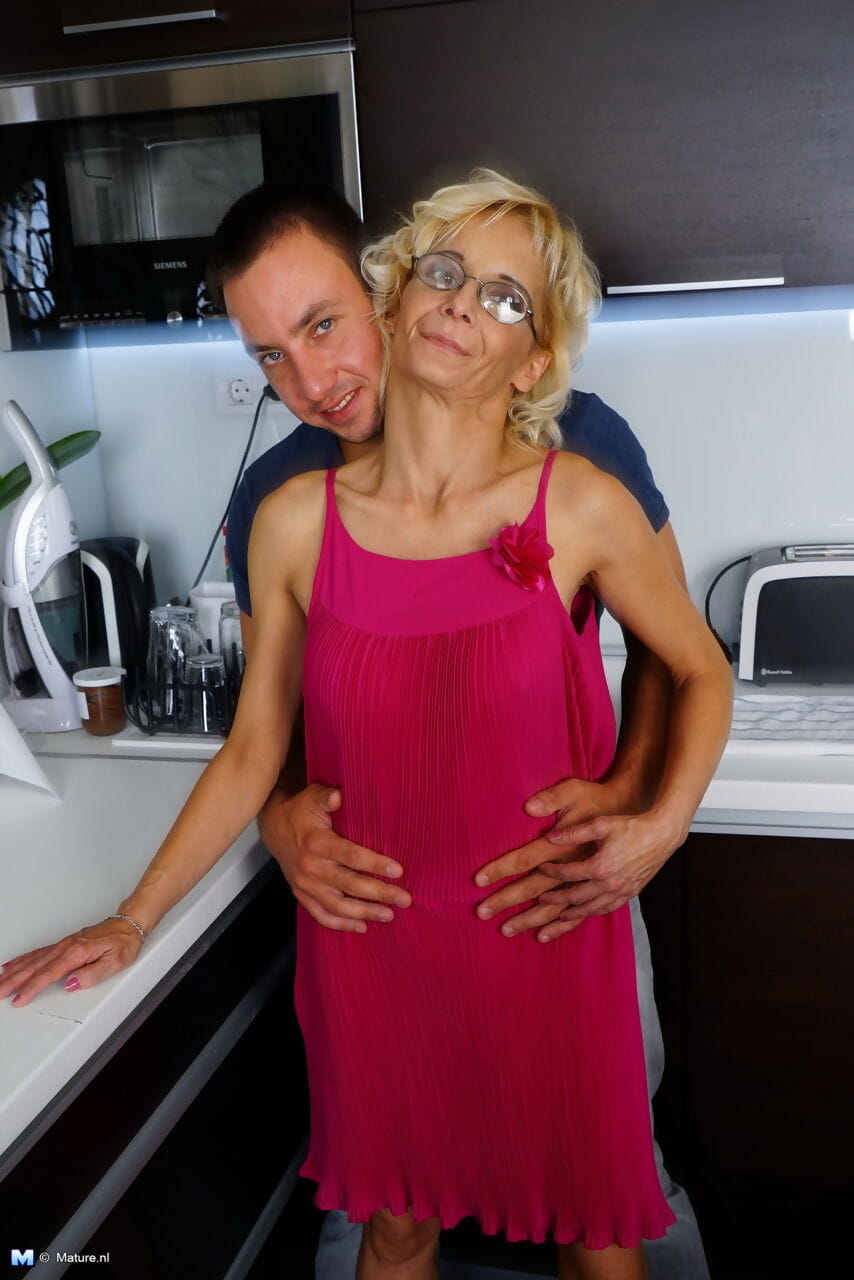 Thin housewife of advancing years gets banged by her toy boy in the kitchen page 1