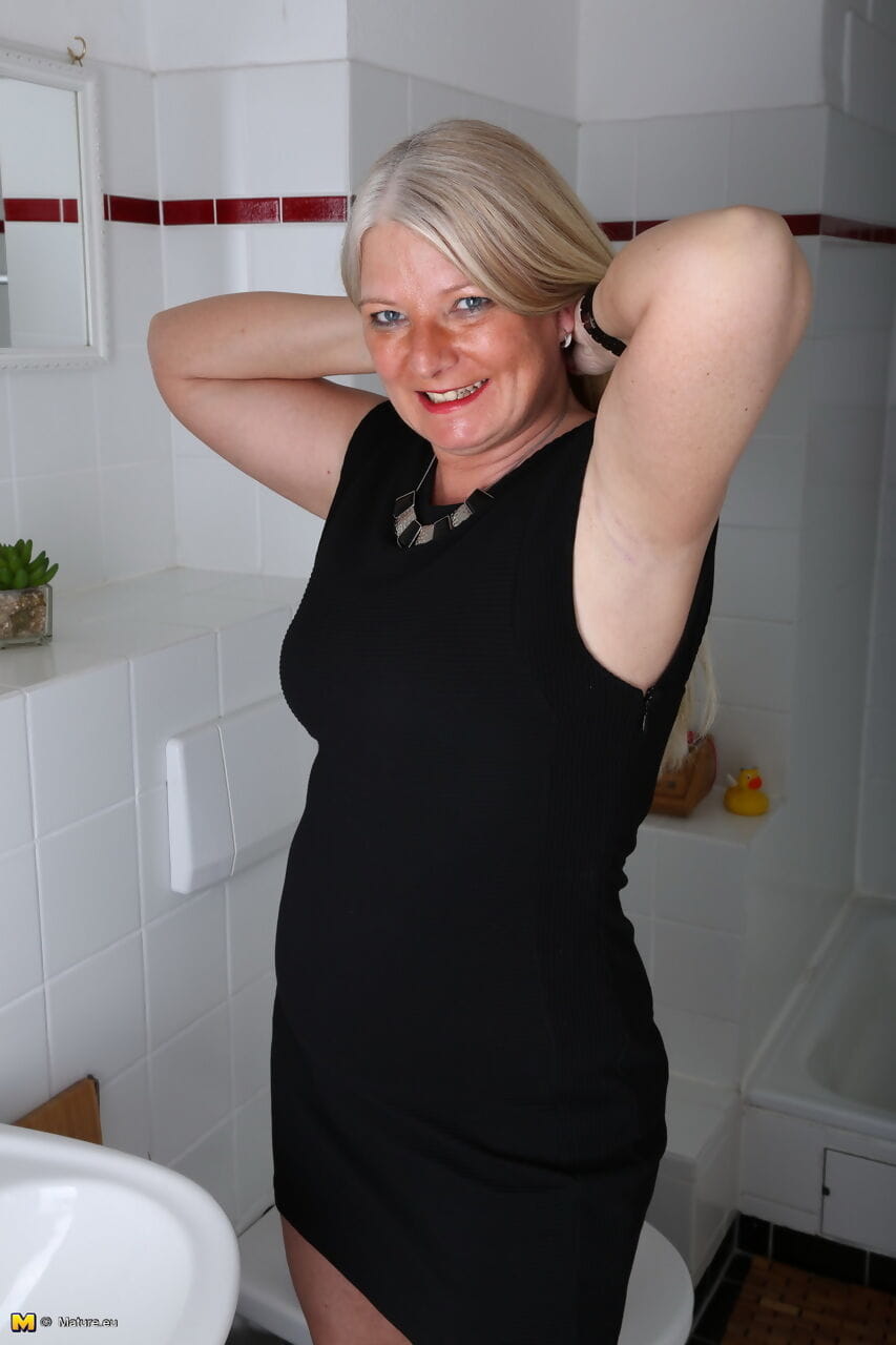 Mature housewife sheds black dress to wet saggy tits & spread legs in shower page 1
