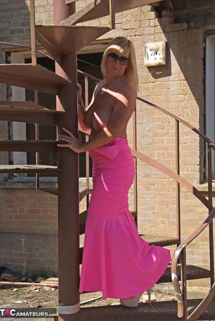Amateur model free her nice melons from long pink dress on spiral staircase page 1