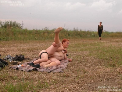 Amateur couple is joined by a gf for a threesome on blanket in farmers field